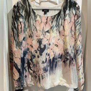 Classy dress shirt.  Flowy arms and banded bottom.